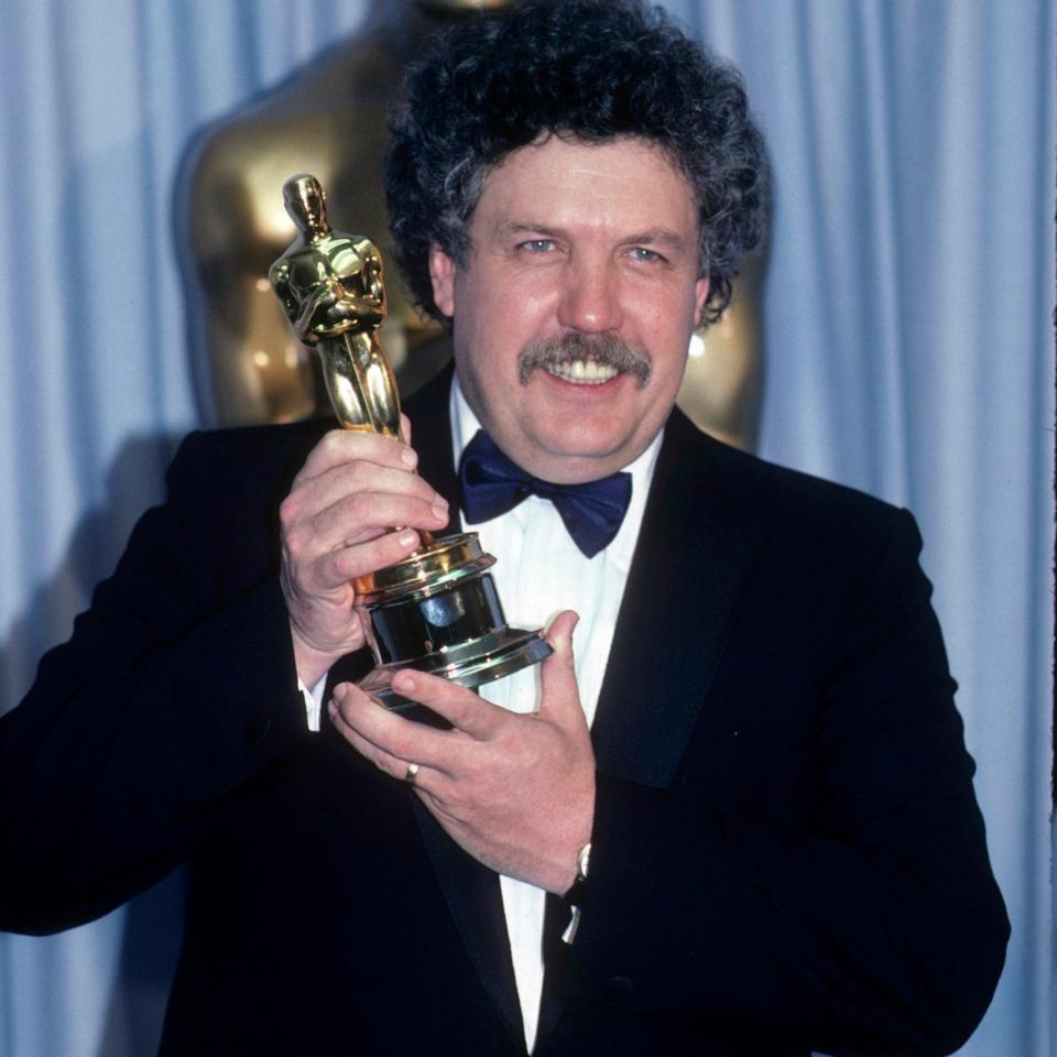 Colin Welland with the Oscar he won for Chariots of Fire, in 1982 - Getty