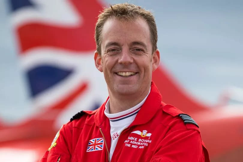 Former Red Arrows pilot Michael Bowden, in a red suit