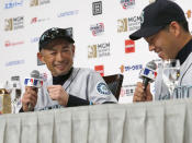 Seattle Mariners' Ichiro Suzuki, left, and pitcher Yusei Kikuchi laugh during a press conference in Tokyo Saturday, March 16, 2019. The Mariners will play in a two-baseball game series against the Oakland Athletics to open the Major League season on March 20-21 at Tokyo Dome. (AP Photo/Toru Takahashi)