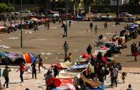 Migrants wait as they hope to obtain humanitarian visas to transit Mexican territory, in Tapachula