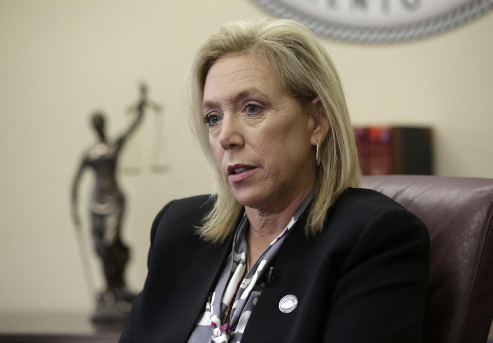 FILE - In this April 27, 2018, file photo, Sacramento County District Attorney Anne Marie Schubert pauses during an interview in her office in Sacramento, Calif. Schubert, the prosecutor best known for pushing to unmask the mysterious Golden State Killer is running as an independent for California attorney general. Schubert is one of three main candidates challenging incumbent Democratic Attorney General Rob Bonta.( AP Photo/Rich Pedroncelli, File)