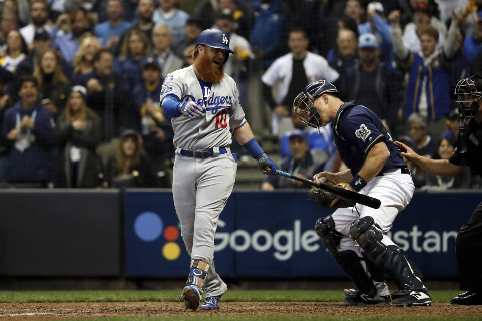 Los Angeles Dodgers' Justin Turner (10) reacts after striking out to end Game 1 of the National League Championship Series baseball game against the Milwaukee Brewers Friday, Oct. 12, 2018, in Milwaukee. The Brewers won 6-5. (AP Photo/Jeff Roberson)