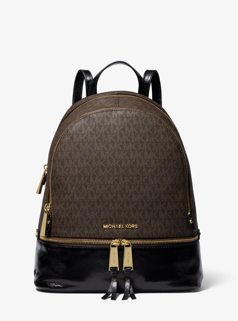 Rhea Medium Logo and Leather Backpack. Image via Michael Kors.