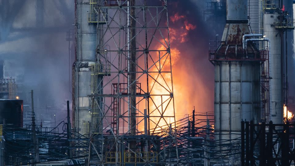 Flames and smoke emerge from the Philadelphia Energy Solutions Refining Complex in Philadelphia on June 21, 2019. - Matt Rourke/AP