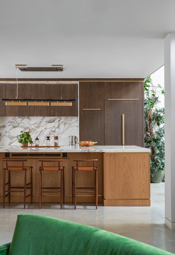 A kitchen with a white granite countertop