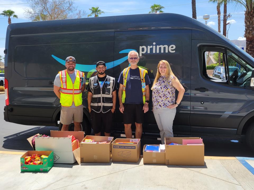 Kasey Nelson, Amazon site manager; Randy Nunez, delivery driver; John Buckner, process assistant; and Debbi Collier, assistant principal, were present at the Amazon employee back-to-school drive.