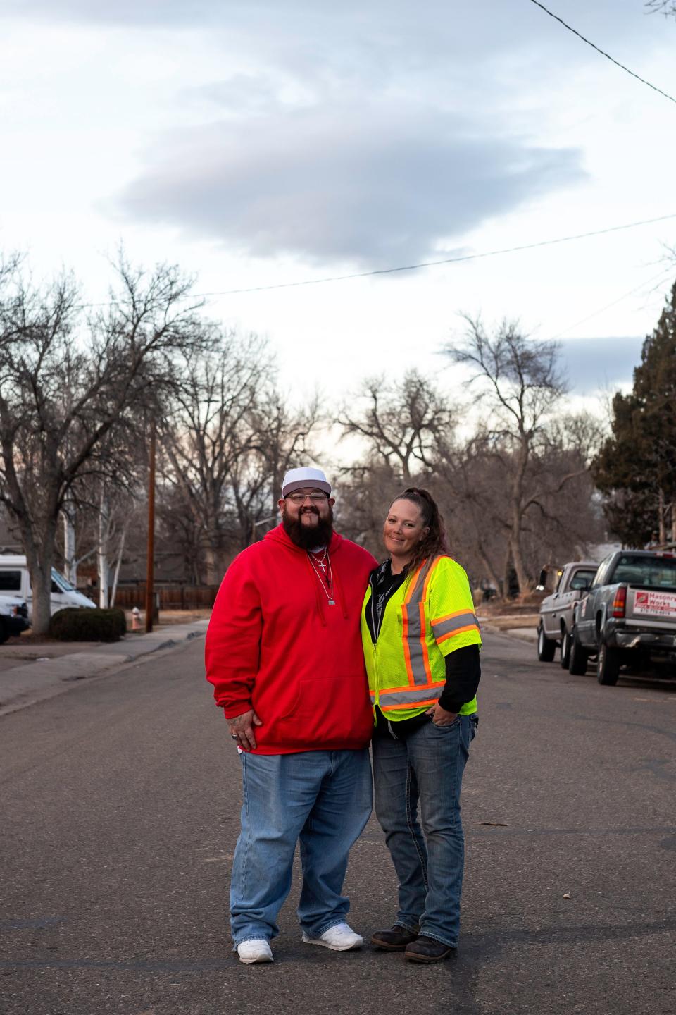 Hans Joseph Pearson, left, and Meggie Branch pose for a portrait outside the North Colorado Health Alliance office in Loveland on Feb. 20.