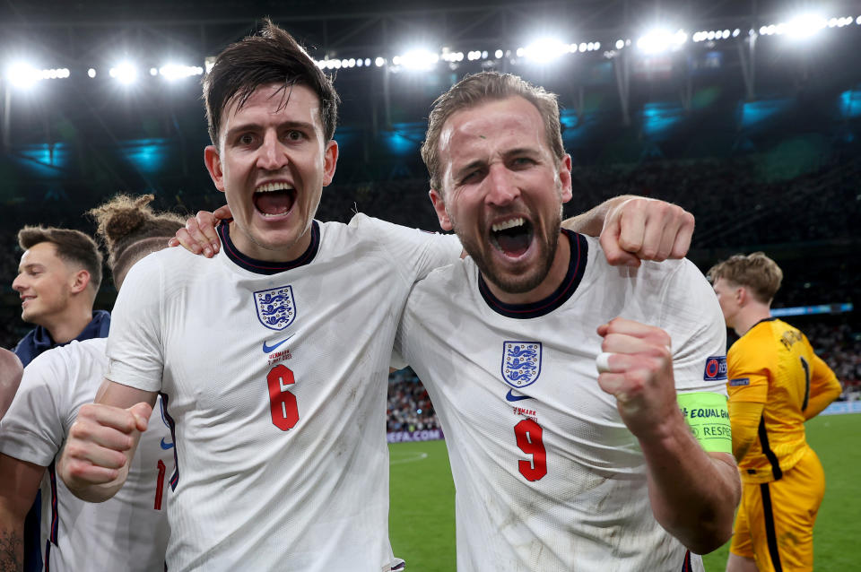 Harry Maguire and Harry Kane celebrate England's victory in their semi-final match against Denmark at Wembley on Wednesday