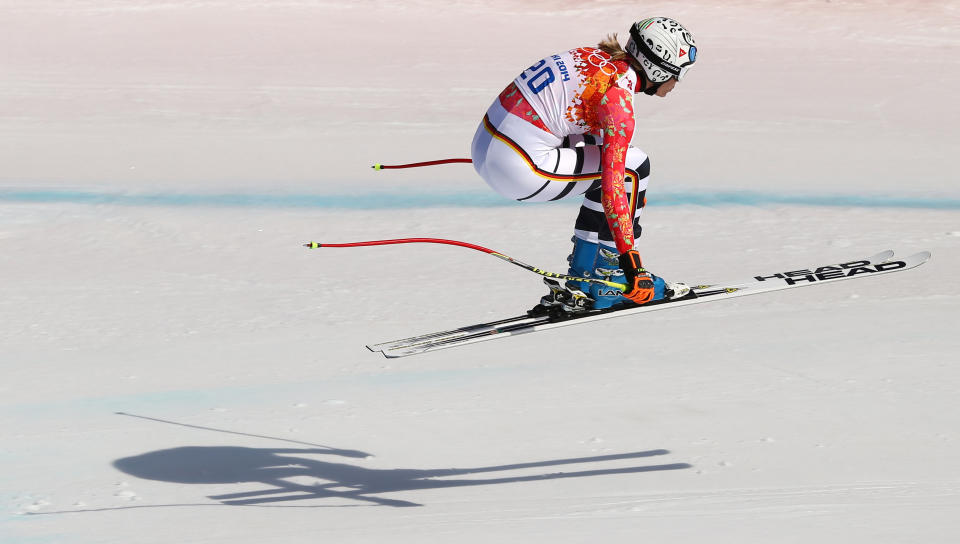 Germany's Maria Hoefl-Riesch jumps during the downhill portion of the women's supercombined at the Sochi 2014 Winter Olympics, Monday, Feb. 10, 2014, in Krasnaya Polyana, Russia. (AP Photo/Alessandro Trovati)