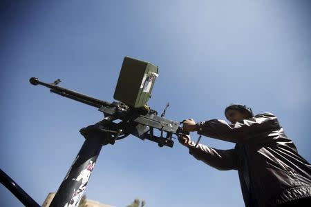 A Houthi militant mans a machine gun mounted on a patrol truck securing a street where a pro-Houthi tribal gathering is being held in Yemen's capital Sanaa December 10, 2015. REUTERS/Mohamed al-Sayaghi