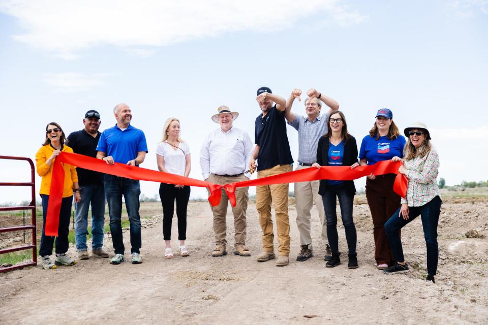 Dave Livermore, Utah director for The Nature Conservancy, and Chris Brown, the group’s director of stewardship, join others preparing to cut the ribbon following the completion of the Freeport Drain project at the Great Salt Lake Shorelands Preserve in Layton on Wednesday, May 17, 2023. | Ryan Sun, Deseret News