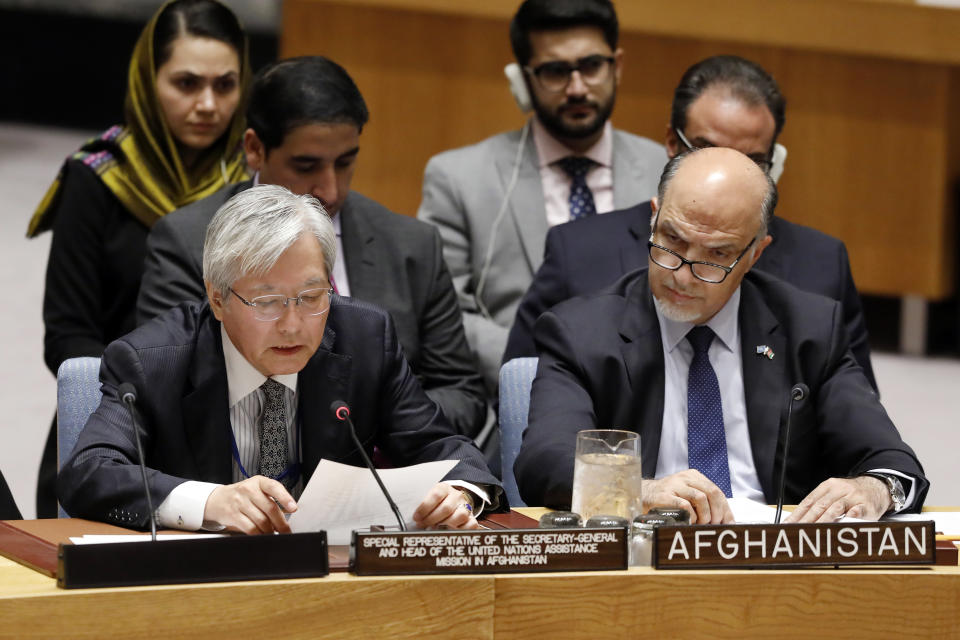 United Nations envoy for Afghanistan Tadamichi Yamamoto, left, addresses the United Nations Security Council, at U.N. headquarters, Monday, Sept. 17, 2018. He is accompanied by Afghanistan's U.N. Ambassador Mahmoud Saikal. (AP Photo/Richard Drew)