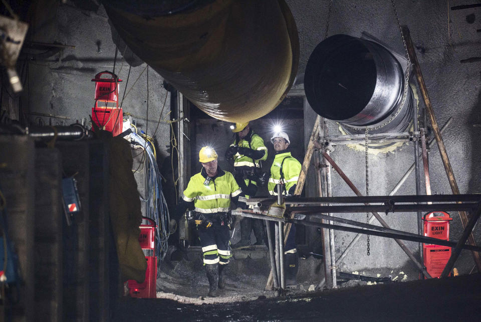 FILE - In this image released by the Pike River Recovery Agency, men walk through after the first of the two airlock doors was opened in the Pike River Mine, near Greymouth on the West Coast of New Zealand on May 21, 2019. More than a decade after a methane explosion killed 29 workers at the New Zealand coal mine, police said on Wednesday, Nov. 17, 2021, they have finally found at least two of the bodies thanks to new camera images. (Neil Silverwood/Pike River Recovery Agency via AP, File)