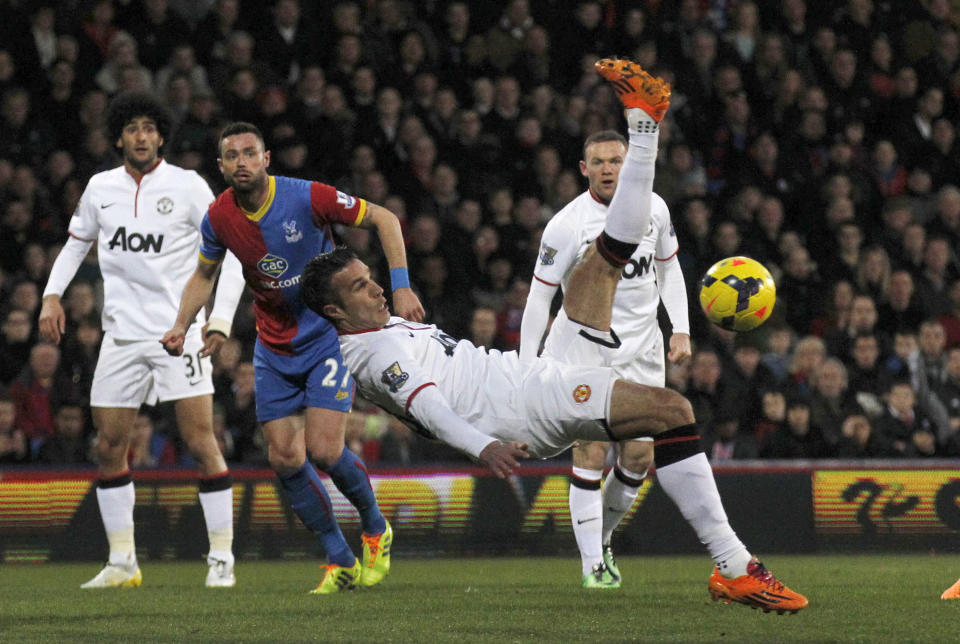 Manchester United's Robin Van Persie attempts a overhead kick at Crystal Palace's goal during their English Premier League soccer match at Selhurst Park, London, Saturday, Feb. 22, 2014. (AP Photo/Sang Tan)