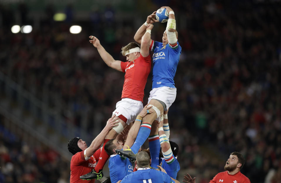 Italy's Sergio Parisse, right, wins a lineout over Wales' Aaron Wainwright during the Six Nations rugby union international between Italy and Wales, at Rome's Olympic Stadium, Saturday, Feb. 9, 2019. (AP Photo/Andrew Medichini)