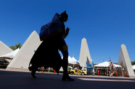 An attendee dressed as Bat Girl arrives for the start of Comic-Con International in San Diego, California, United States, July 20, 2016. REUTERS/Mike Blake