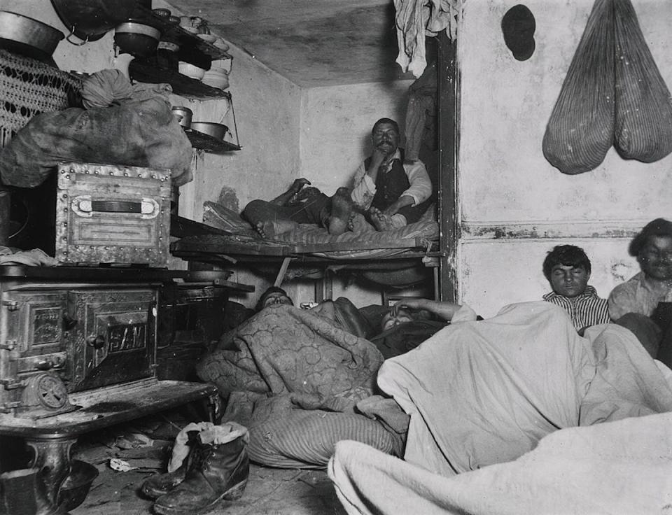 Photograph by Jacob Riis for How the Other Half Lives: ‘Lodgers in Bayard Street Tenement, Five Cents a Spot.’ <a href="https://commons.wikimedia.org/wiki/File:Jacob_Riis,_Lodgers_in_a_Crowded_Bayard_Street_Tenement.jpg" rel="nofollow noopener" target="_blank" data-ylk="slk:Wikimedia Commons;elm:context_link;itc:0;sec:content-canvas" class="link ">Wikimedia Commons</a>