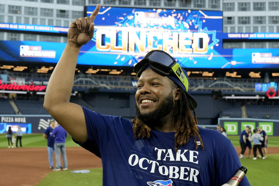 Toronto Blue Jays' Vladimir Guerrero Jr. celebrates on the field after the team clinched a berth in the AL wild card series following a baseball game against the Tampa Bay Rays in Toronto, Sunday, Oct. 1, 2023. (Frank Gunn/The Canadian Press via AP)