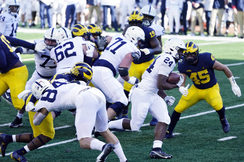 Penn State running back Keyvone Lee (24) rushes for a 6-yard touchdown during the first half of an NCAA college football game against Michigan, Saturday, Nov. 28, 2020, in Ann Arbor, Mich. (AP Photo/Carlos Osorio)