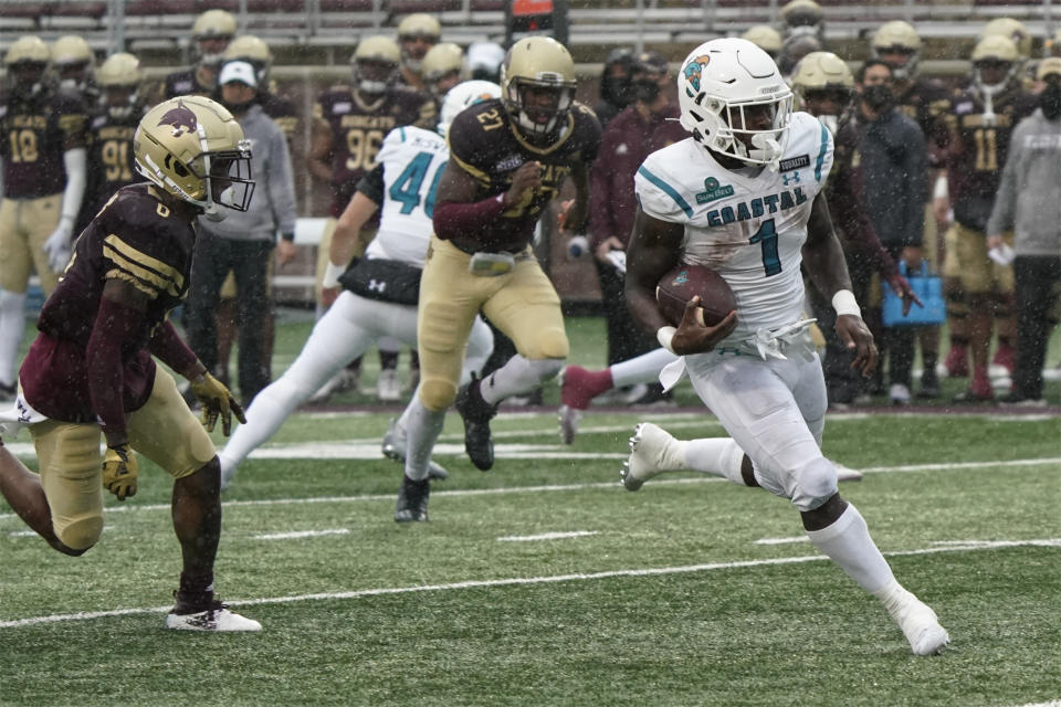 Coastal Carolina's CJ Marable (1) runs for a touchdown against Texas State during the second half of an NCAA college football game in San Marcos, Texas, Saturday, Nov. 28, 2020. (AP Photo/Chuck Burton)