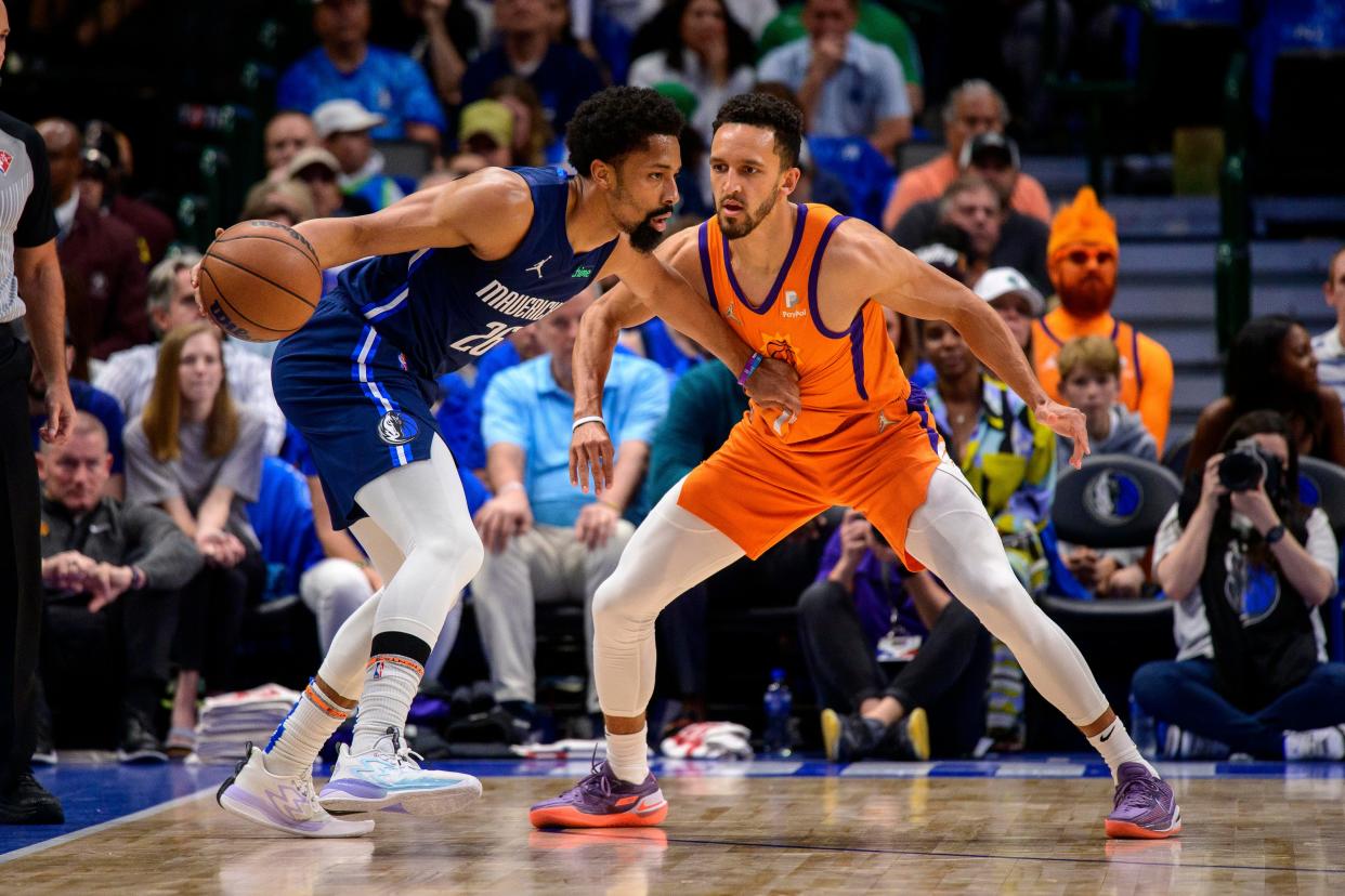 May 8, 2022; Dallas, Texas, USA; Phoenix Suns guard Landry Shamet (14) guards Dallas Mavericks guard Spencer Dinwiddie (26) during the second quarter during game four of the second round for the 2022 NBA playoffs at American Airlines Center.