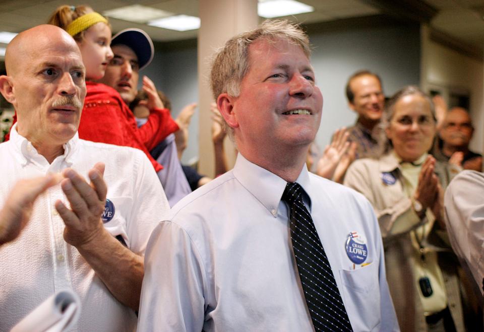 Gainesville mayoral candidate Craig Lowe, center, is congratulated by supporters after hearing elections results during the Gainesville City Commission runoff elections at the Supervisor of Elections office on Tuesday, April 13, 2010.