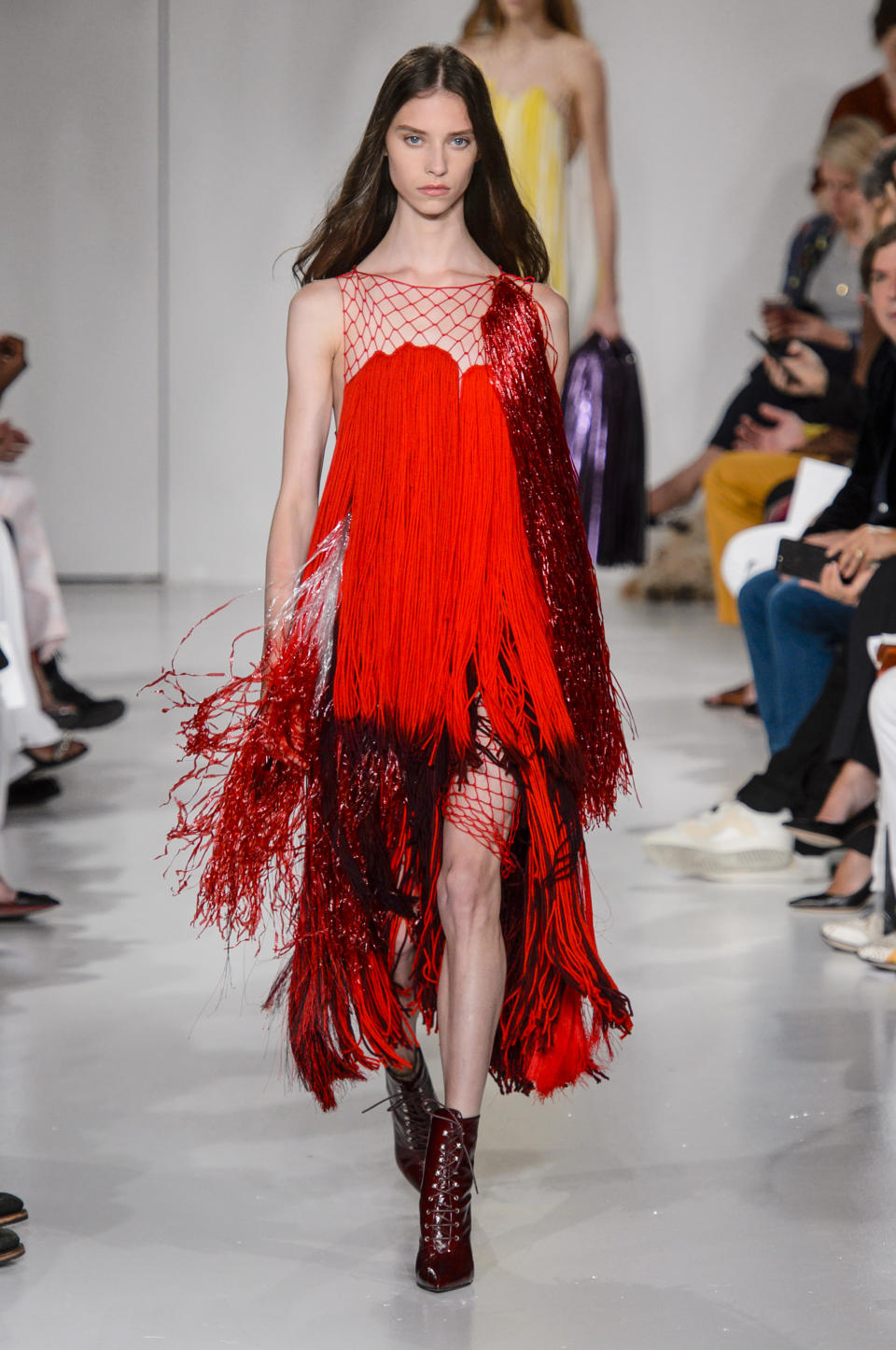 <p><i>Model wears a red-fringe dress from the Calvin Klein SS18 collection. (Photo: IMAXtree) </i></p>