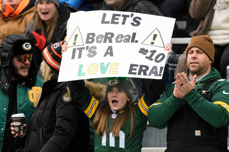 A Green Bay Packers fan holds up a sign supporting quarterback Jordan Love (10) during warmups prior to the game against the Chicago Bears at Lambeau Field.