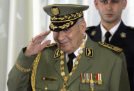 FILE - In this photo taken Thursday, Dec. 19, 2019, Algerian military chief Gen. Ahmed Gaid Salah attends president Abdelmajid Tebboune's inauguration ceremony in the presidential palace, in Algiers. Algeria's powerful military chief died unexpectedly Monday, according to government media reports, leaving his country gripped by political uncertainty after 10 months of pro-democracy protests. (AP Photo/Fateh Guidoum, File)
