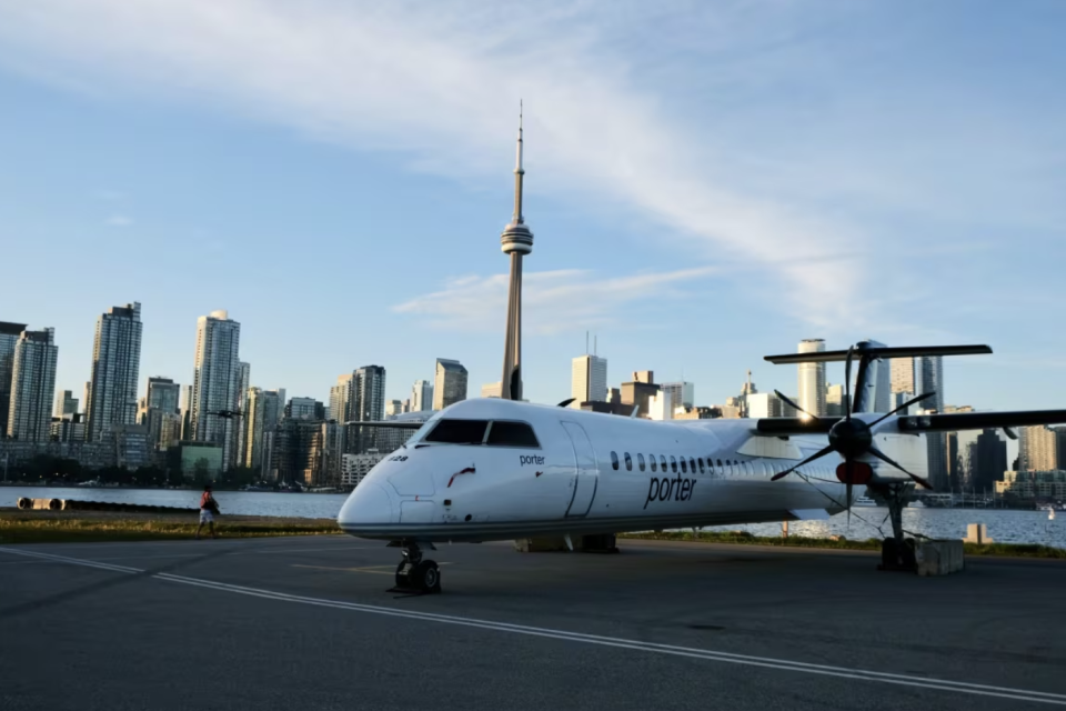 The parents of a 14-year-old girl say they're angry their daughter was removed from a Porter Airlines flight in August and left to fend for herself. Above, a Porter plane sits on the runway at Billy Bishop Toronto City Airport. (Patrick Morrell/CBC )