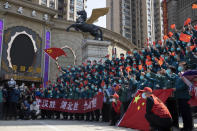 FILE - In this April 15, 2020, file photo, a farewell ceremony is held for the last group of medical workers who came from outside Wuhan to help the city during the coronavirus outbreak in Wuhan in central China's Hubei province. The Chinese city of Wuhan is looking back on a year since it was placed under a 76-day lockdown beginning Jan. 23, 2020. (AP Photo/Ng Han Guan, File)