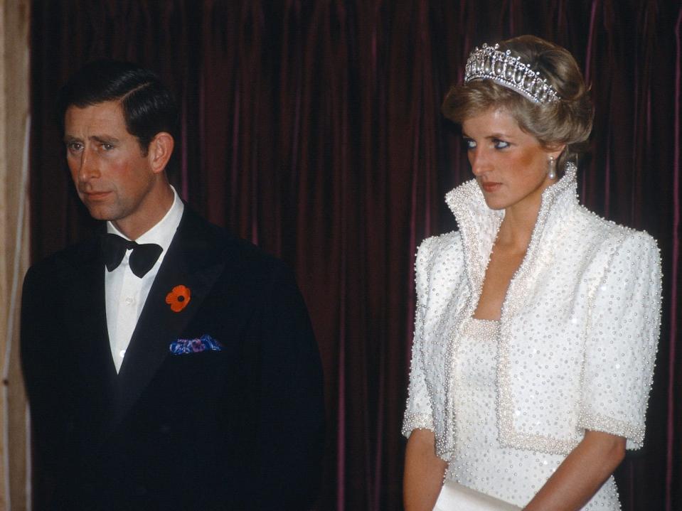 Prince Charles, Prince of Wales and Diana, Princess of Wales, wearing a white dress and jacket embroidered with sequins and pearls designed by Catherine Walker and known as the 'Elvis' dress with the Cambridge Lover's Knot Tiara, during a visit to the Culture Centre in Hong Kong on November 8, 1989 in Hong Kong, China.