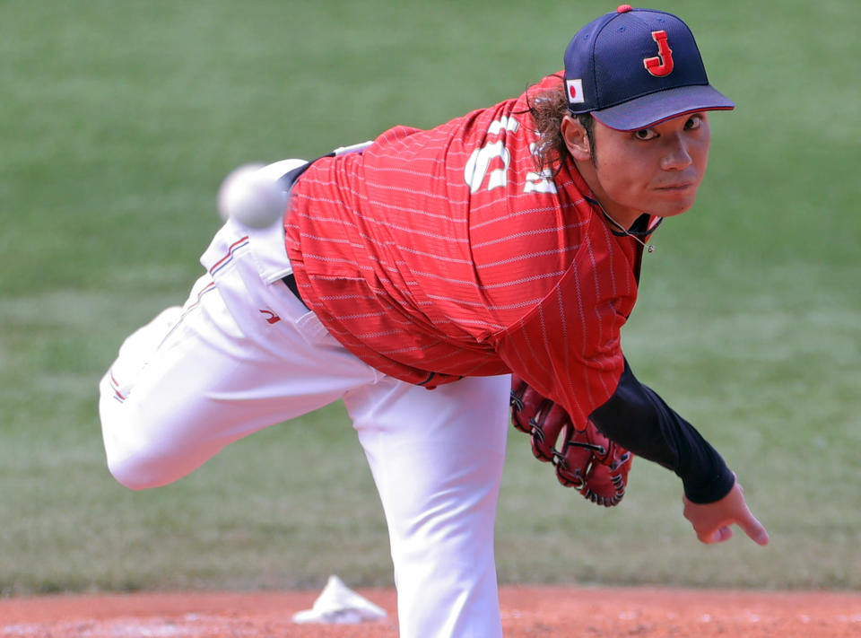 <p>Japan's relief pitcher Hiromi Itoh hurls the ball during the seventh inning of the Tokyo 2020 Olympic Games baseball opening round group A game between Japan and Mexico at Yokohama Baseball Stadium in Yokohama, Japan, on July 31, 2021. (Photo by KAZUHIRO FUJIHARA / AFP) (Photo by KAZUHIRO FUJIHARA/AFP via Getty Images)</p> 