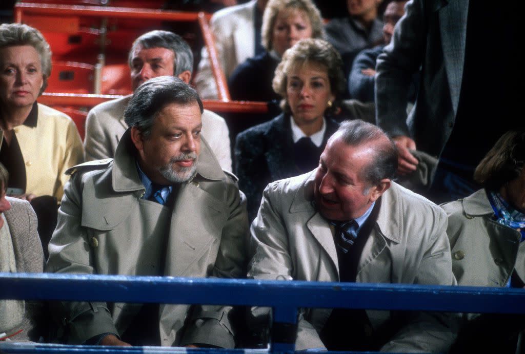 National League President A. Bartlett Giamatti (L) with former National League President Chuck Feeney (R) seen in the stands during a Major League Baseball game circa 1988