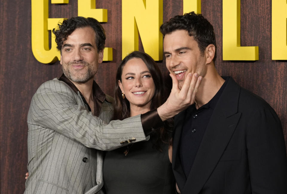 From left, Daniel Ings, Kaya Scodelario and Theo James, cast members in "The Gentlemen," pose together at a photo call for the Netflix film, Wednesday, Feb. 28, 2024, at the Tudum Theatre in Los Angeles. (AP Photo/Chris Pizzello)