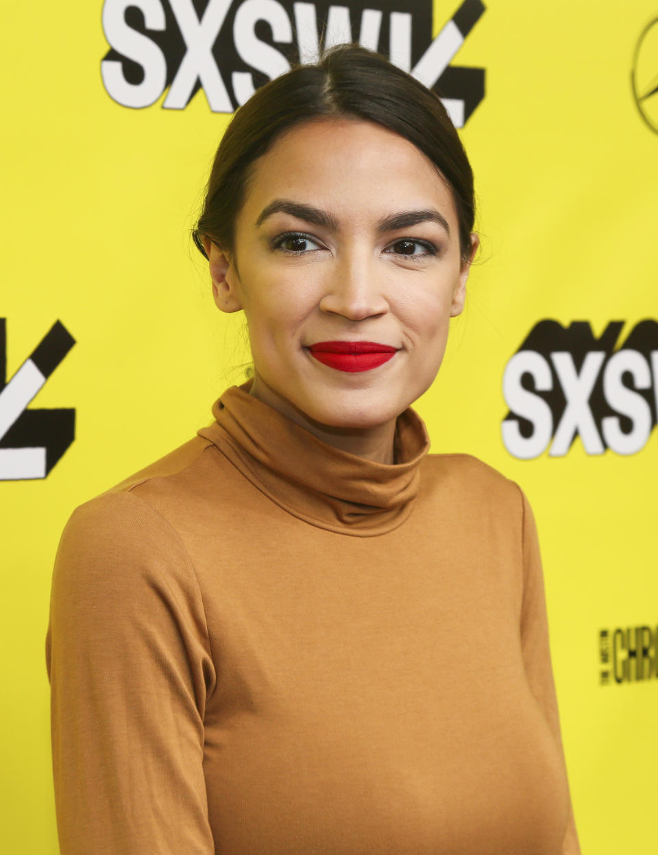 Alexandria Ocasio-Cortez arrives for the world premiere of "Knock Down the House" at the Paramount Theatre during the South by Southwest Film Festival on Sunday, March 10, 2019, in Austin, Texas. (Photo by Jack Plunkett/Invision/AP)