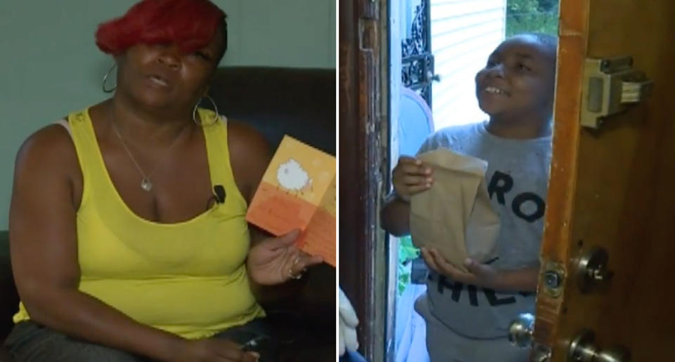 Champale Anderson pictured holding a card and a child at her front door receiving a paper bag full of food.