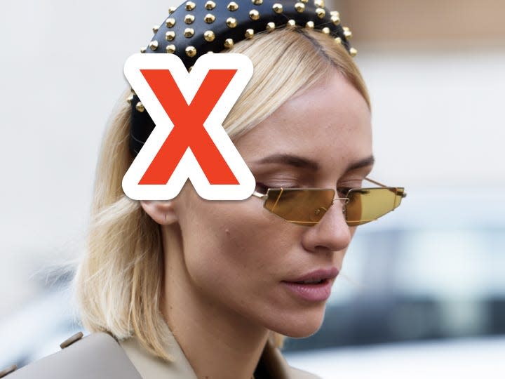 red x over woman's tiny yellow tinted sunglasses