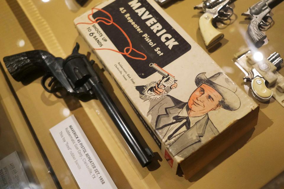 A toy pistol set modeled after the television show "Maverick" is on view in the National Cowboy & Western Heritage Museum exhibit "Playing Cowboy" Friday, March 24, 2023, in Oklahoma City. Featuring Western books, games and toys for children, "Playing Cowboy" is on view through May 7 at the OKC museum.