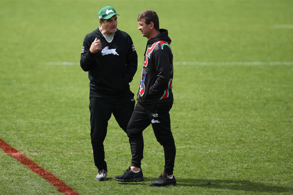 Mario Fenech, pictured here speaking to Rabbitohs coach Jason Demetriou during a training session.