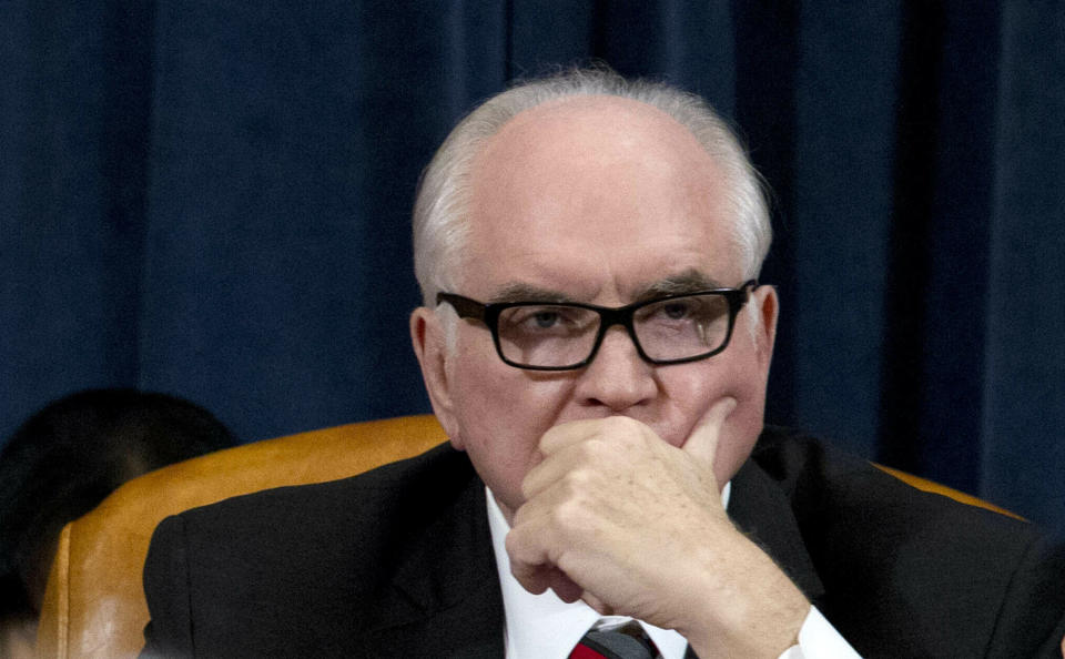 FILE - In this Feb. 7, 2019, file photo Rep. Mike Kelly, R-Pa., listens during a hearing on Capitol Hill in Washington. At least 10 lawmakers and three congressional caucuses have ties to organizations that received federal coronavirus aid, according to government data released this week. Among businesses that received money was a dealership owned by Kelly. (AP Photo/Jose Luis Magana, File)