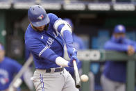 Toronto Blue Jays' Lourdes Gurriel Jr. hits a two-run double during the first inning against the Kansas City Royals in the first baseball game of a doubleheader, Saturday, April 17, 2021, in Kansas City, Mo. (AP Photo/Charlie Riedel)