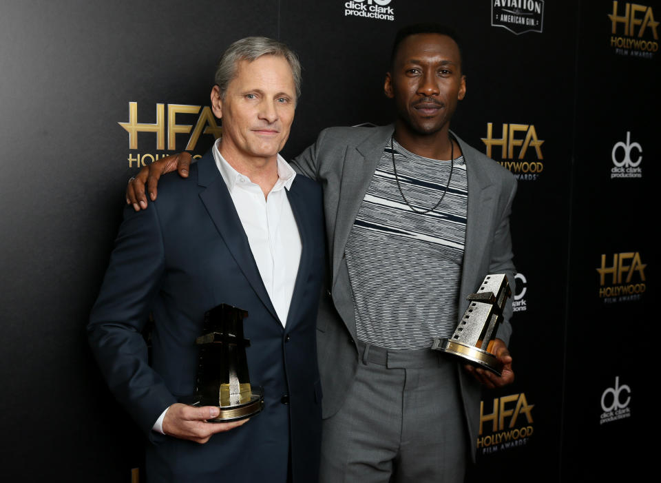 22nd Hollywood Film Awards - Photo Room - Beverly Hills, California, U.S., 04/11/2018 - Viggo Mortensen (L) and Mahershala Ali pose backstage with their Hollywood Ensemble Award for "Green Book." REUTERS/Danny Moloshok