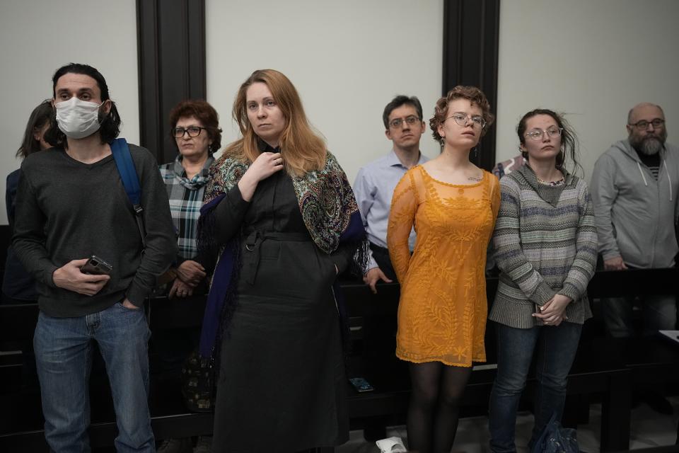 FILE - Supporters of the human rights group Memorial react during a court session in Moscow, Russia, on Tuesday, April 5, 2022. In 2021, a court ordered the closure of Memorial, one of the country's oldest and most prominent human rights organizations that drew international acclaim for highlighting repression in the Soviet Union. (AP Photo, File)