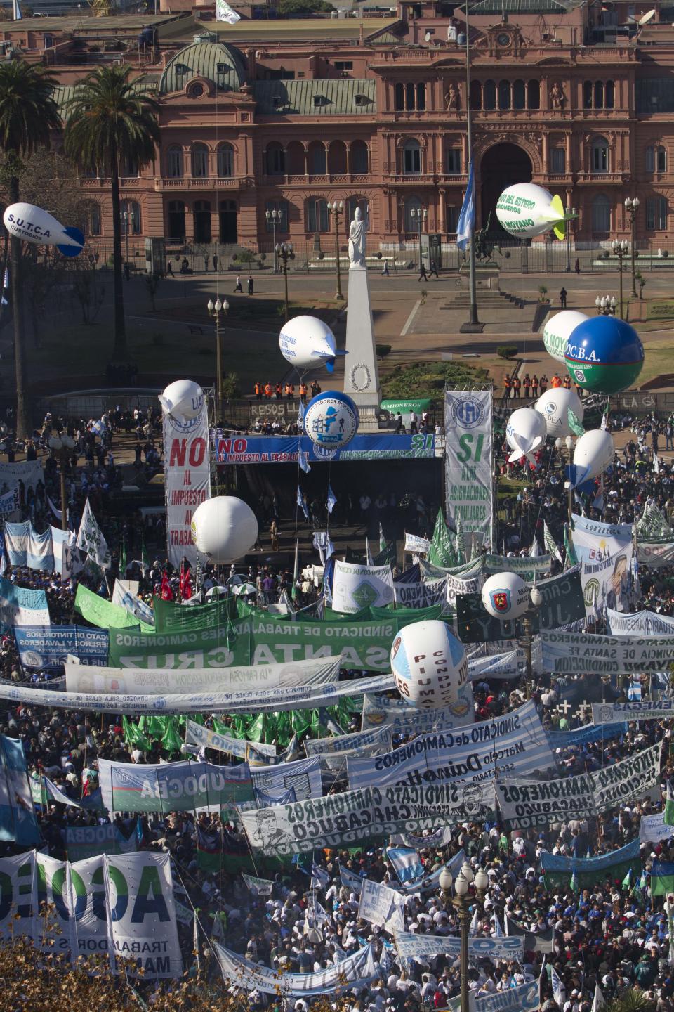 Demonstrators fill Plaza de Mayo in front of the government palace in Buenos Aires, Argentina, Wednesday, June 27, 2012. A strike and demonstration called by union leader Hugo Moyano demands steps that would effectively reduce taxes on low-income people, among other measures. (AP Photo/Eduardo Di Baia)