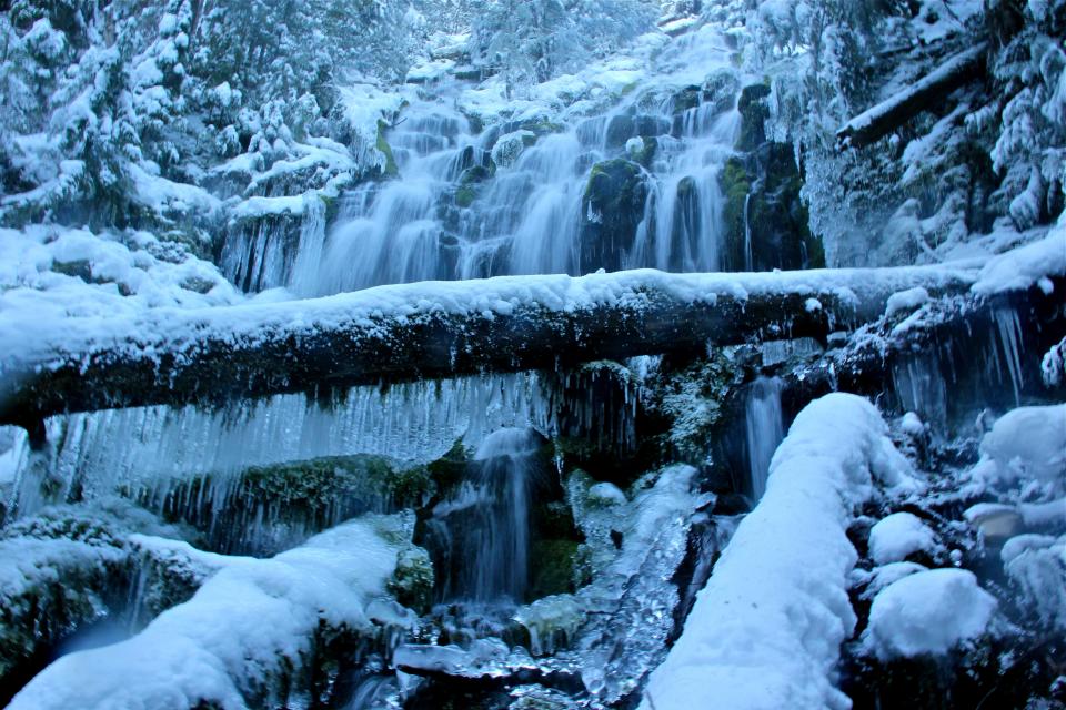 Upper Proxy Falls, located near Mckenzie Pass east of Eugene, can be visited during winter with a long snowshoe or ski trip.