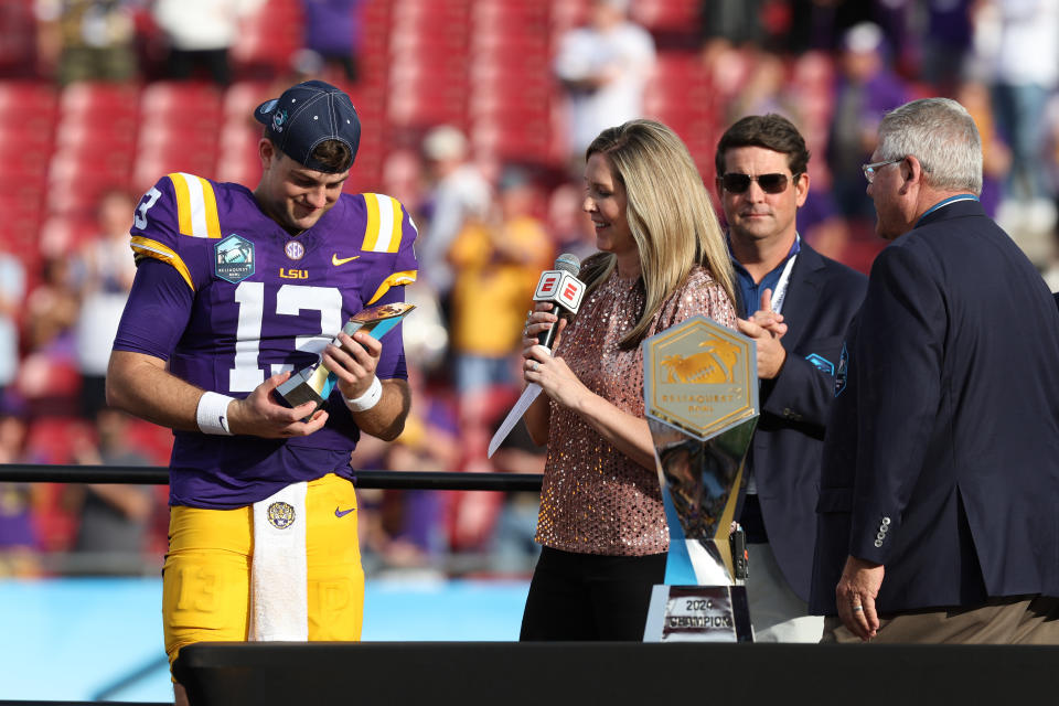 Jan. 1, 2024; Tampa, Florida; LSU Tigers quarterback <a class="link " href="https://sports.yahoo.com/ncaaf/players/322267/" data-i13n="sec:content-canvas;subsec:anchor_text;elm:context_link" data-ylk="slk:Garrett Nussmeier;sec:content-canvas;subsec:anchor_text;elm:context_link;itc:0">Garrett Nussmeier</a> (13) is awarded the MVP award after beating the Wisconsin Badgers in the ReliaQuest Bowl at Raymond James Stadium. Nathan Ray Seebeck-USA TODAY Sports