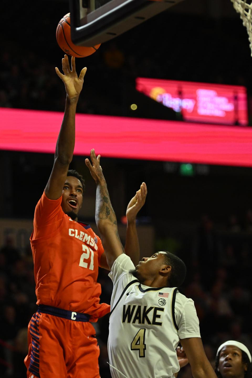 Jan 17, 2023; Winston-Salem, North Carolina, USA; Clemson Tigers forward Chauncey Wiggins (21) shoots the ball over Wake Forest Demon Deacons guard Daivien Williamson (4) during the second half at Lawrence Joel Veterans Memorial Coliseum. Mandatory Credit: William Howard-USA TODAY Sports