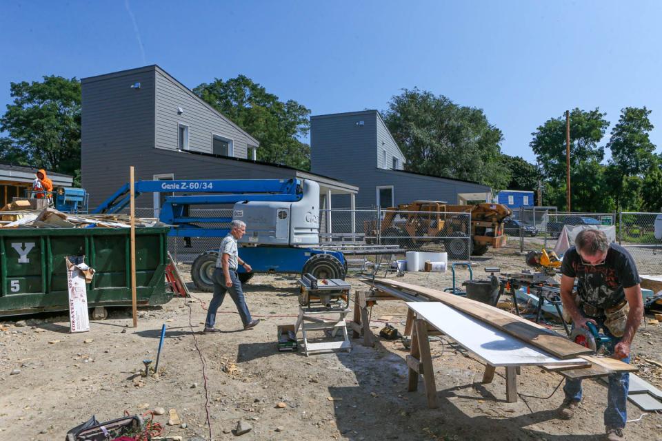 Houses under construction in Providence's Olneyville section. Demand in the construction sector promises to remain high for the foreseeable future, according to state employment officials.