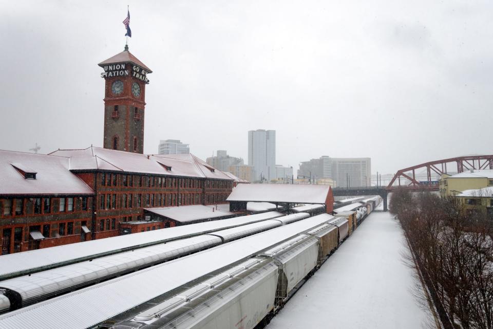 PORTLAND, OR - DECEMBER 8: Train passes by Union Station in Portland, OR during a snowstorm on December 8, 2016